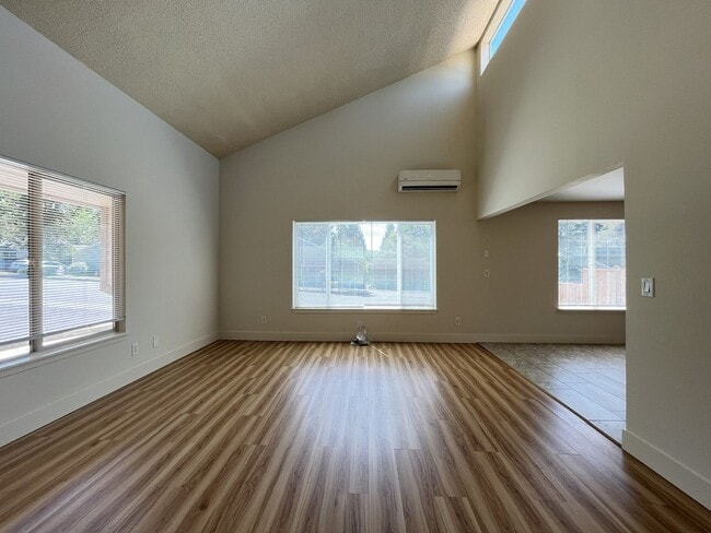 Building Photo - Bright and Airy Home with Stainless Steel Kitchen, Vaulted Ceilings & Washer + Dryer