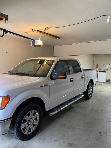 Garage tandem parking for two small cars. - 831 N Zeyn St