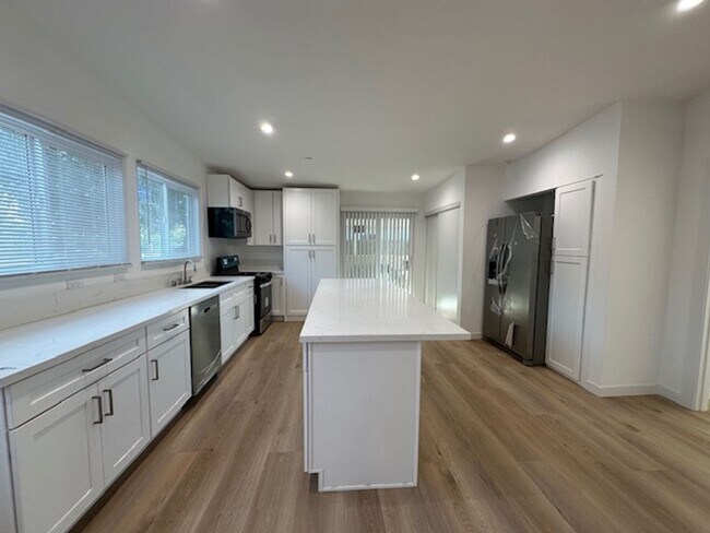 Building Photo - Completely remodeled 4+2 sprawled across a...