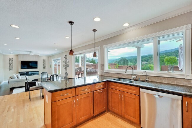 Building Photo - Remodeled 5 Bedroom Home with Heated Pool, Hillside Views, Solar, and Sunrise and Sunset Views in...