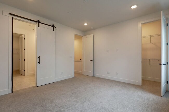 Building Photo - Live Where Style Meets Convenience – 2BR Townhome + Garage