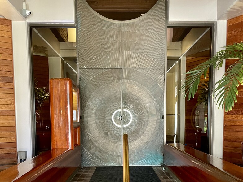 Entry way with welcoming waterfall. Office and security is on the right of entryway - 1221 Victoria St