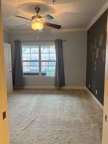 primary bedroom with view to private balcony - 301 Criddle St