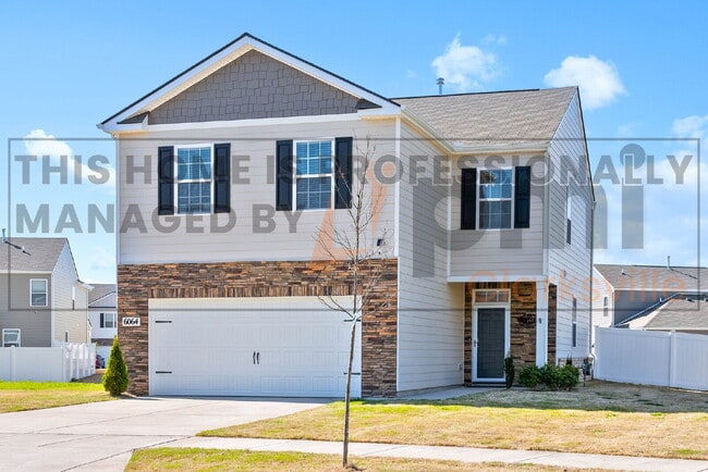 Building Photo - "JUST REDUCED - Charming Four Bedroom Retr...