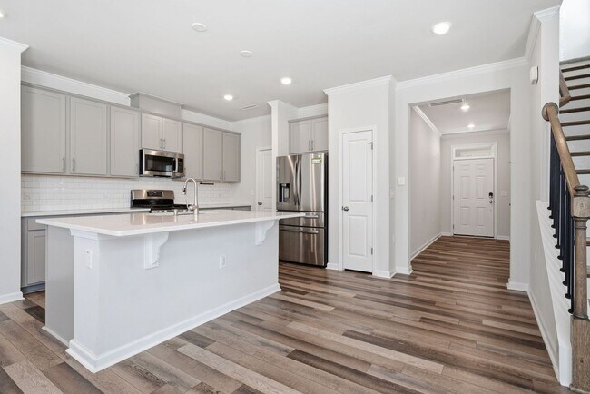 Building Photo - Upgraded 3BR Townhome in Wake Forest | Open Layout, Garage & Resort-Style Amenities