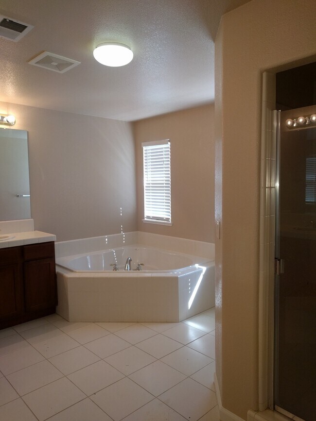 Building Photo - Gated Community Stunner ready to be called...