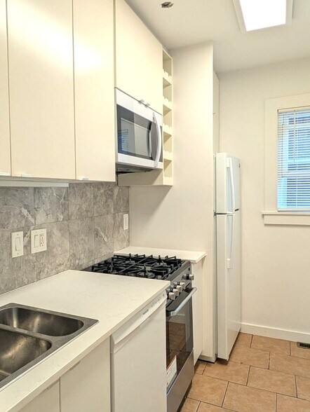 full sized refrig and dishwasher new microwave venthood, new stove - 40 Lyon St
