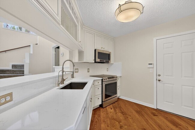 Building Photo - Available Now! Waterfront Living at Its Best – Pool, Decks & Gated Privacy