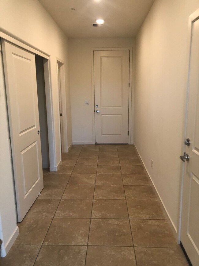 Building Photo - CORNER LOT - END UNIT - NO YARD TO MAINTAI...