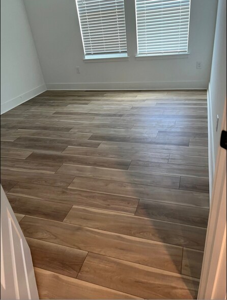 New flooring for all bedrooms, no rugs. - 14990 Lebeau Loop