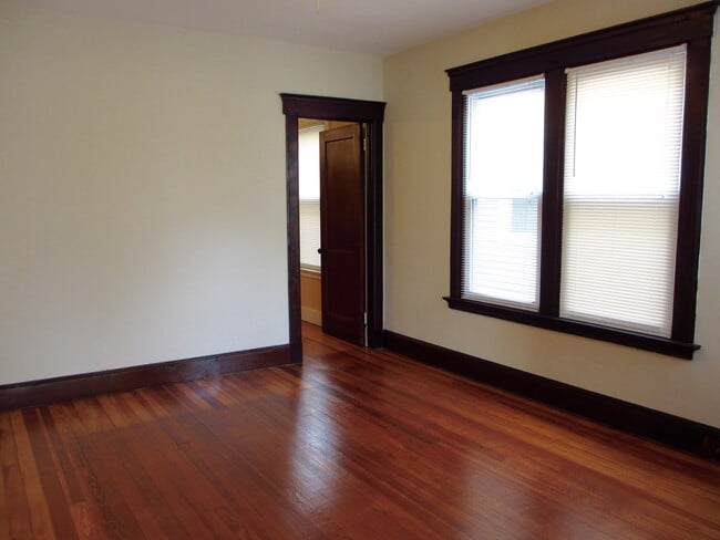 Dining room - sunny & spacious; door to kitchen - 127 Foster St