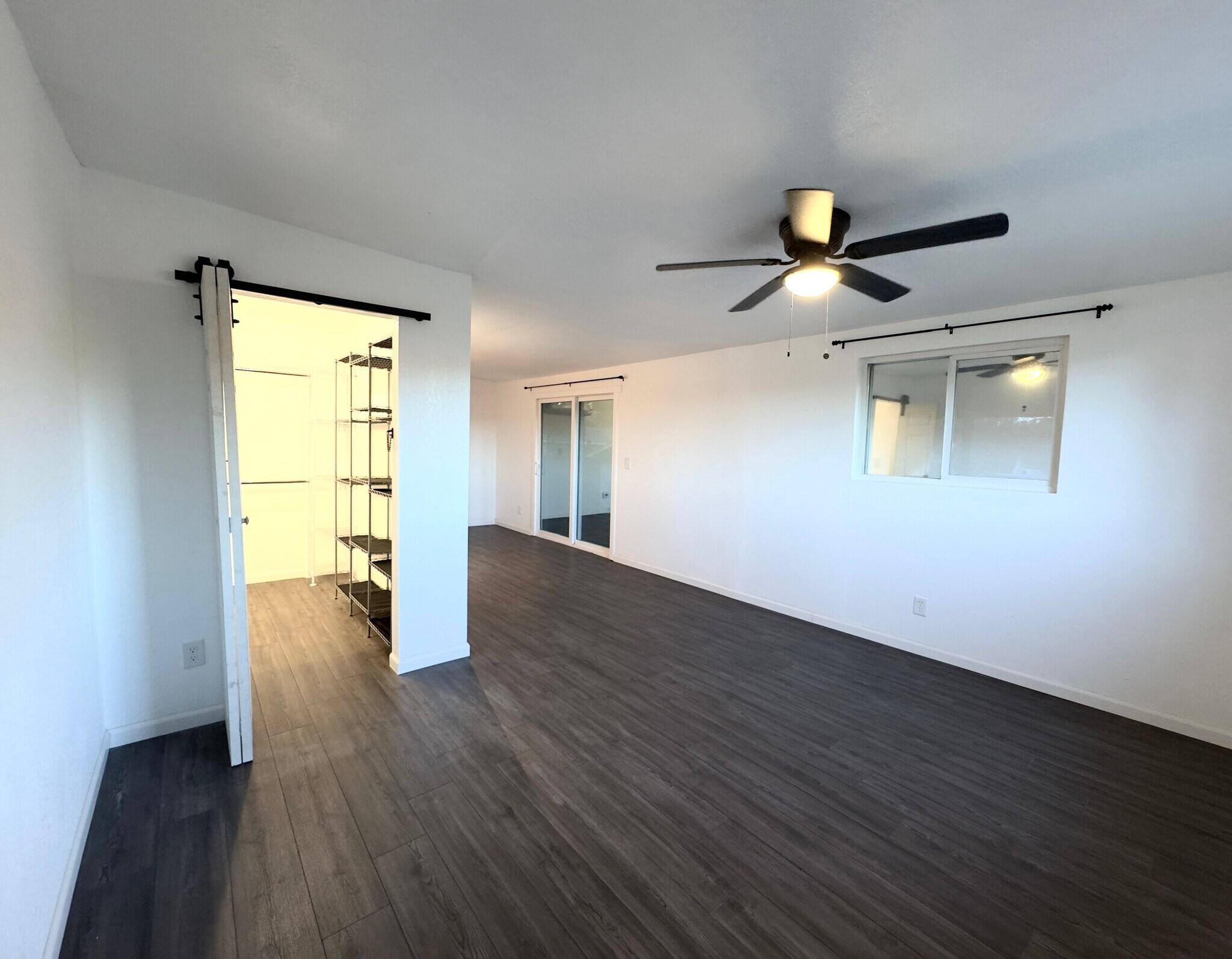 Primary suit with view into the bathroom and sliders to deck - 16060 39th Ave