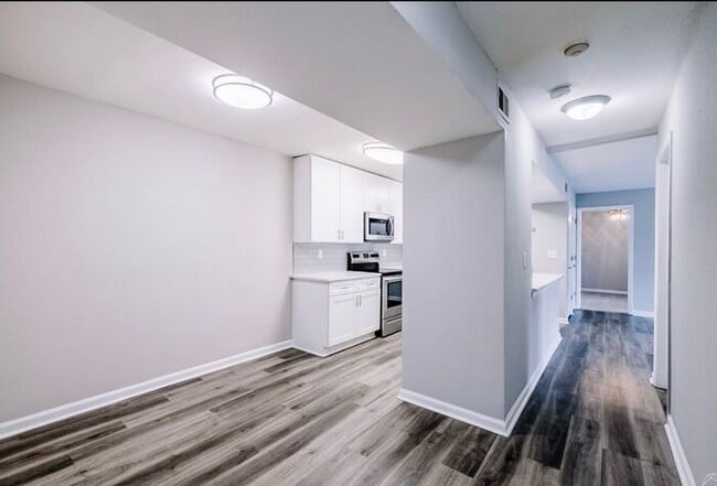 Building Photo - Spacious 2-Bedroom Elite Apartment with Private Balconies & Washer/Dryer