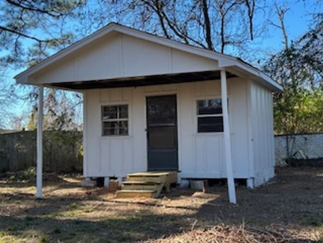 Building Photo - Updated Four Bedroom/Two Bath/Two Car Carport/Fenced/Storage Bldg