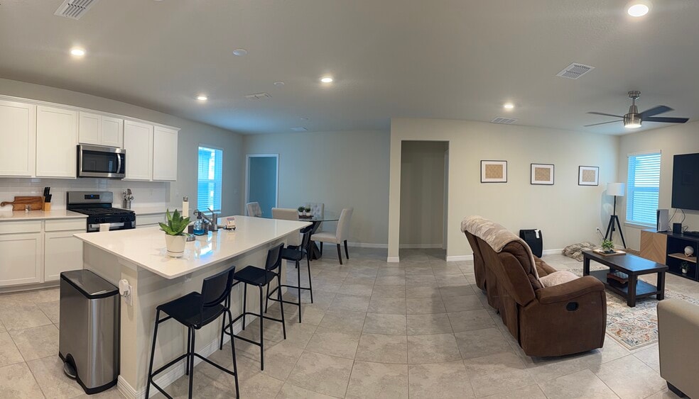 Open kitchen/living/dining - 3438 Orange Rose Loop