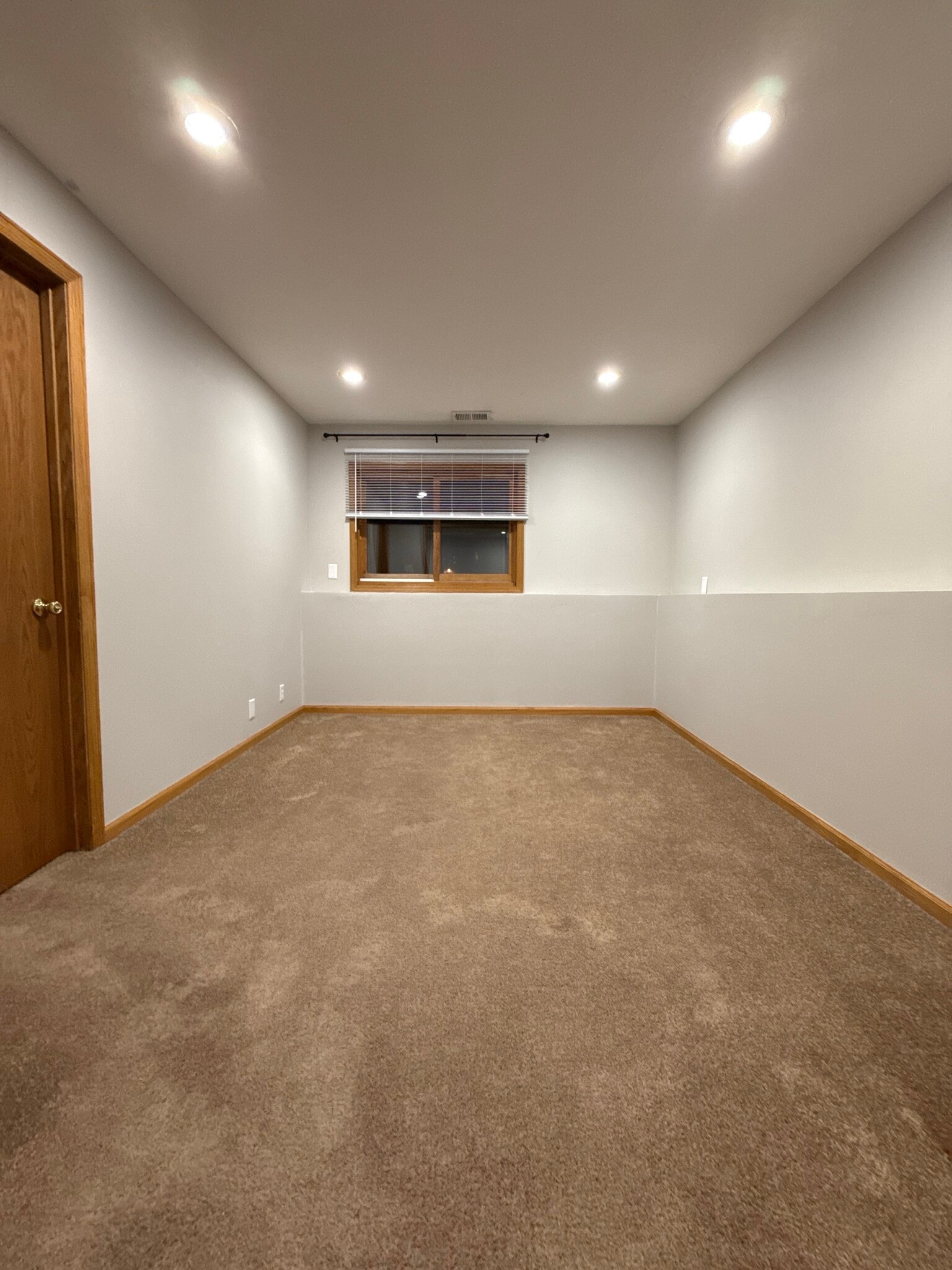 Additional lower-level space with recessed lighting—flexible use. - 9092 Goldenrod Ln N