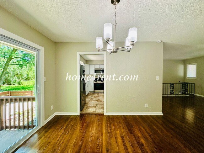 Building Photo - Updated Raytown Ranch w/ Wood Floors, SS Appliances, Finished Basement and a Fenced Yard!