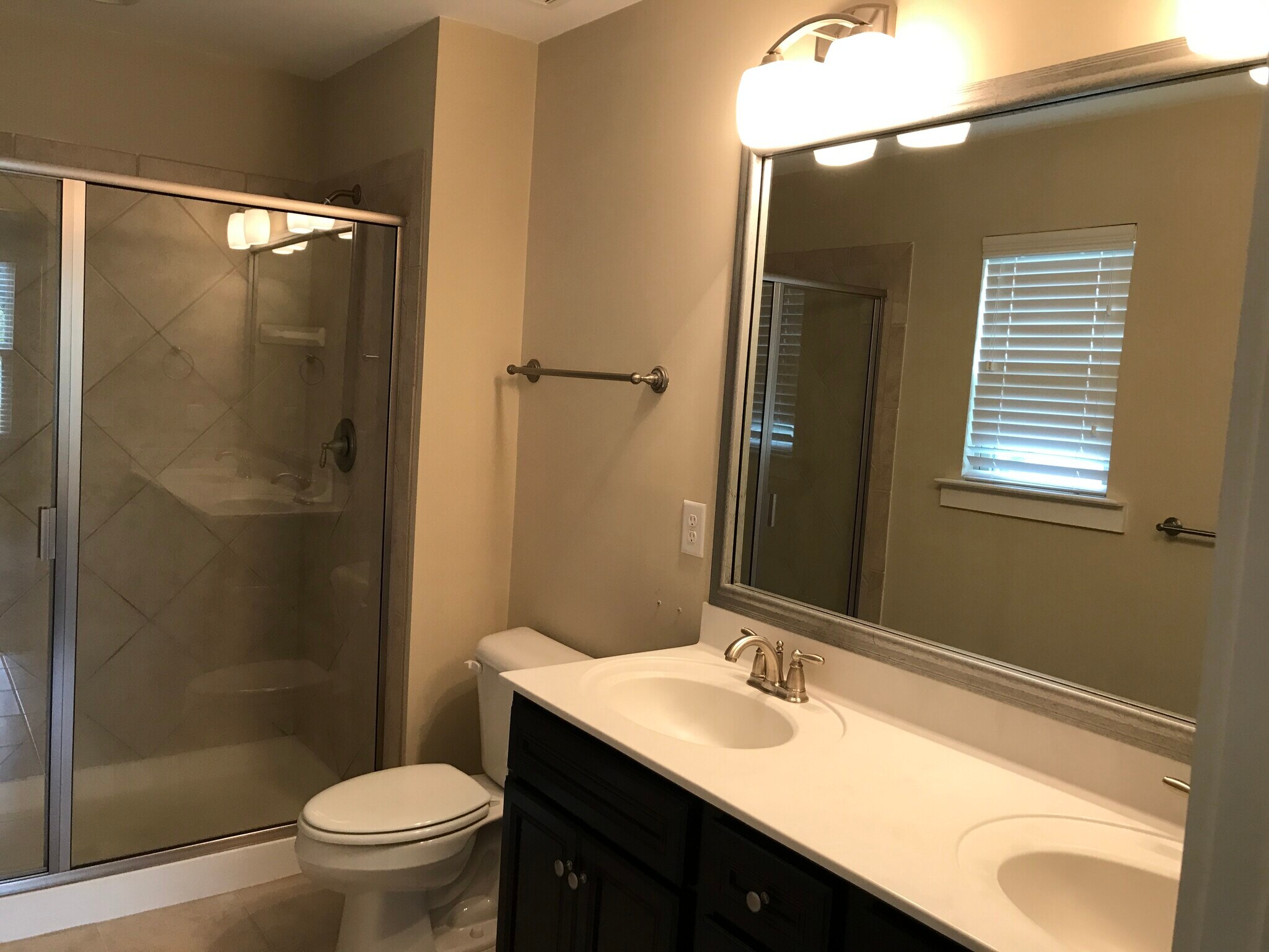 Master bath with tiled shower and double vanity - 6417 Swatner Drive
