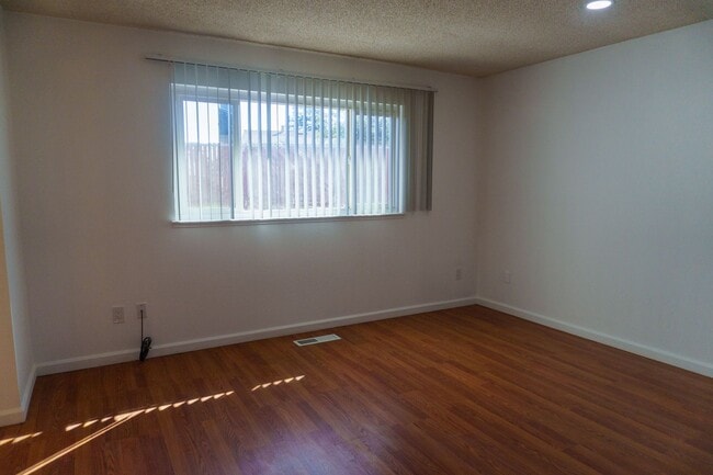 Building Photo - Spacious Three Bedroom, Two Bathroom House featuring Two Car Garage With Huge Yard