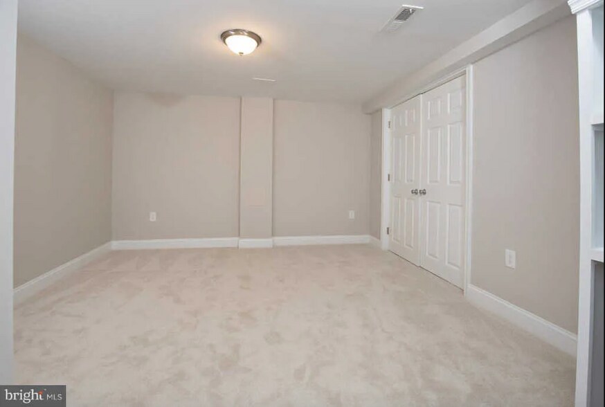 Downstairs bedroom from doorway - 127 S Jordan St