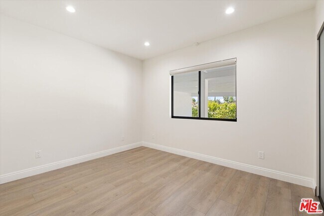 Building Photo - 11700 Woodley Ave