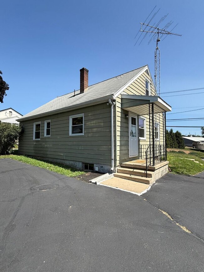 Building Photo - Charming 4-Bedroom Cape Cod Home with Spacious Yard & Storage