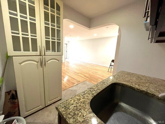 Building Photo - 104-27 38th Ave