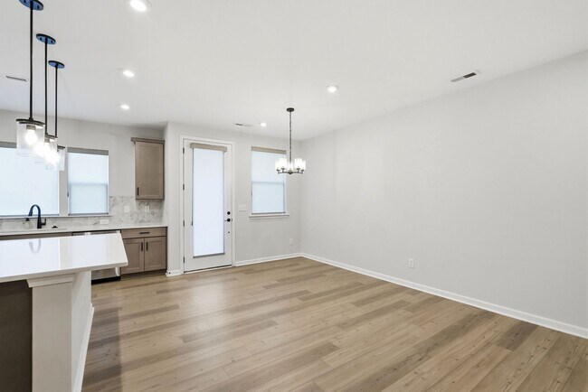 Building Photo - Like-New LoSo Townhome | 3BR + Loft | 2-Car Garage | Move-In Ready