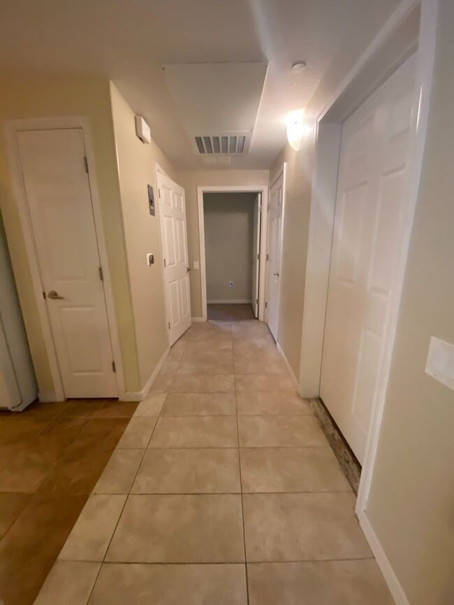 Building Photo - First Floor Unit with 2 Car Garage with Di...
