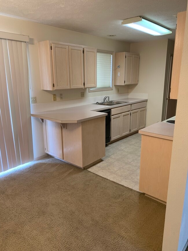 Building Photo - 3418 E 57th Ave