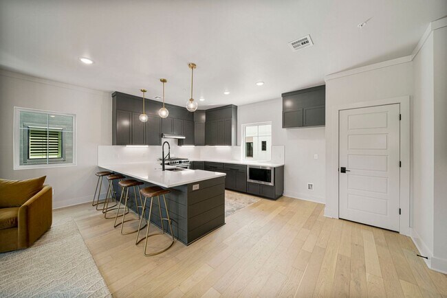 Building Photo - Discover modern elegance in the newly constructed Edgewater Condominiums, a boutique community fe...