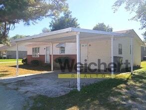 Building Photo - Quality finishes and adaptable design in a desirable location