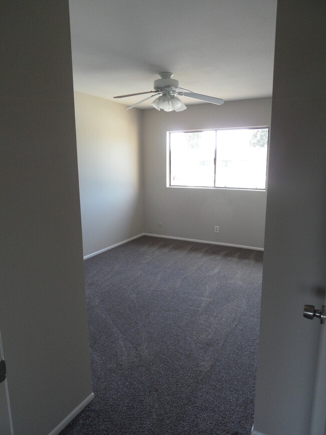 Building Photo - Two Story 4 BR 2.5 BA Condo With 2 Car Garage