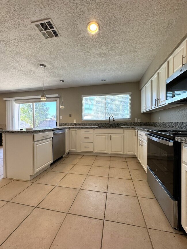 Building Photo - CORNER LOT 3 BEDROOM PLUS DEN WITH FIREPLACE AND LARGE YARD