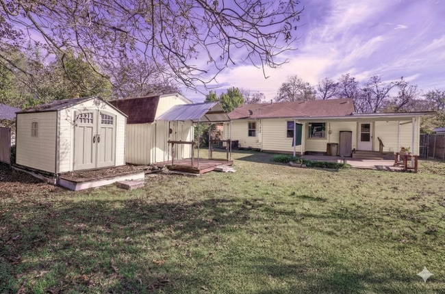 Building Photo - **WELL-MAINTAINED HOME WITH FENCED BACKYARD WITH TWO STORAGE BUILDINGS AVAILABLE FOR RENT FOR THE...