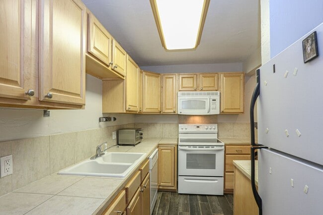 Building Photo - Walk to everything! Partially Furnished! Flexible lease terms!