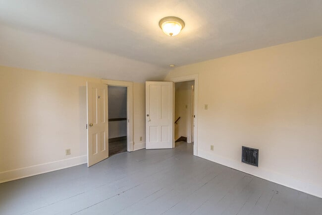 Upstairs back bedroom viewed from window side - 715 E 10th St
