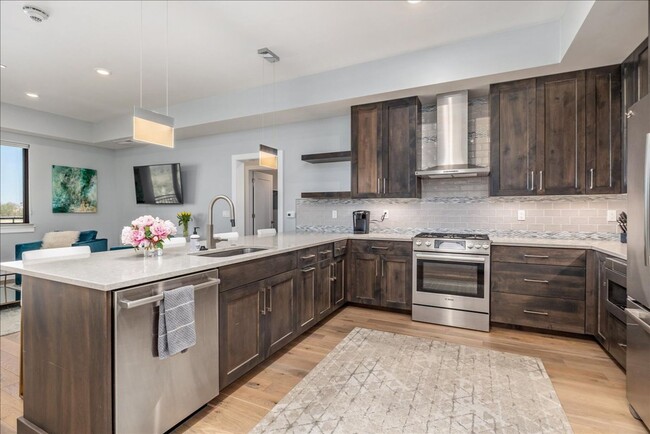 Building Photo - COME HOME TO REFINED DOWNTOWN LUXURY CONDO...
