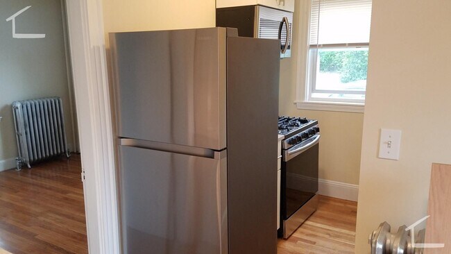 Building Photo - Large, newly renovated 3 bed near the Green Line and Commuter Rail!