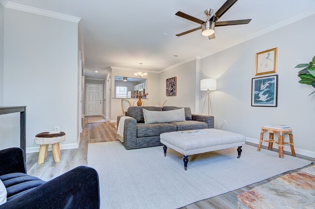 Building Photo - Discover this beautifully updated Raintree townhome featuring an open floor plan and a range of c...