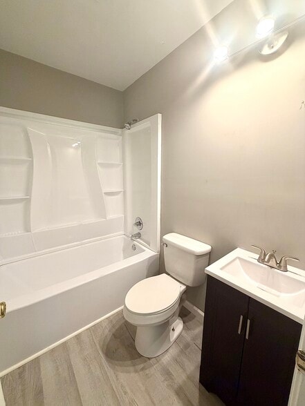 Bathroom - updated full bathroom featuring a tub/shower combination and modern vanity. - 125 Trio Ln