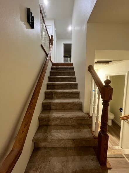 Stairs up to bedroom level. - 2143 SE Douglas Ave