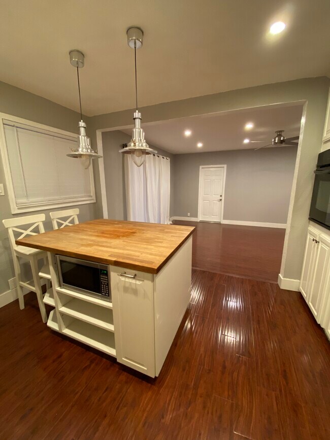 Microwave and trash built into island - 8561 Cedar Dr