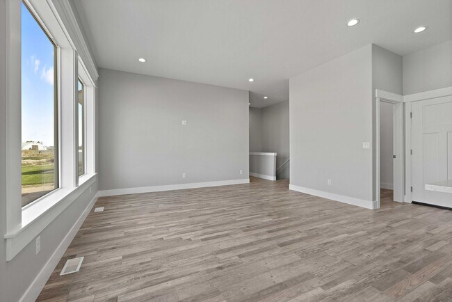 Building Photo - NEW HOME with large garage stalls and unfinished basement for additional storage