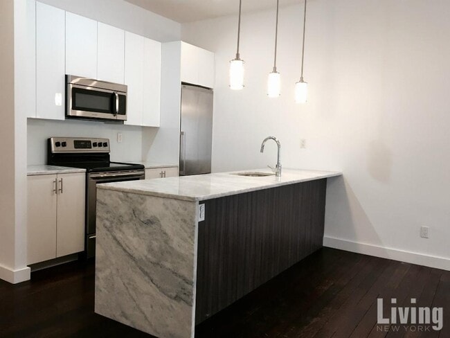 Building Photo - East Village 3 Bdr/2 Bath Duplex with Private Garden & Condo Finishes!