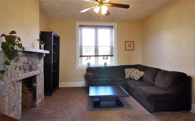 The family room is huge, with even more natural light and a decorative fireplace. - 1109 Haslage Ave