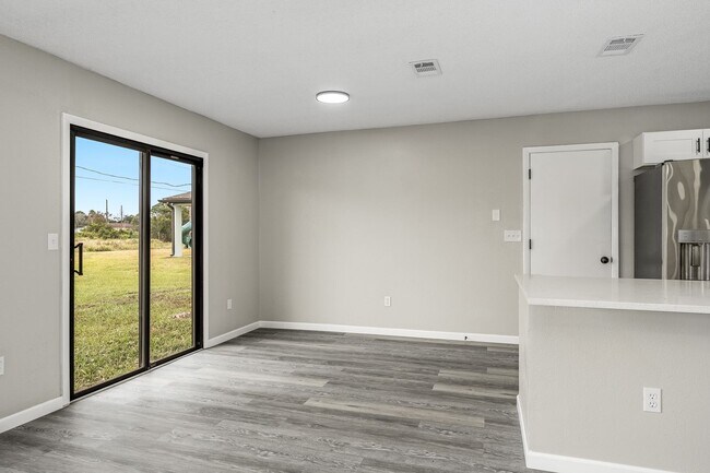 Building Photo - Charming Palm Bay Retreat - Perfect for Relaxation and Entertainment!