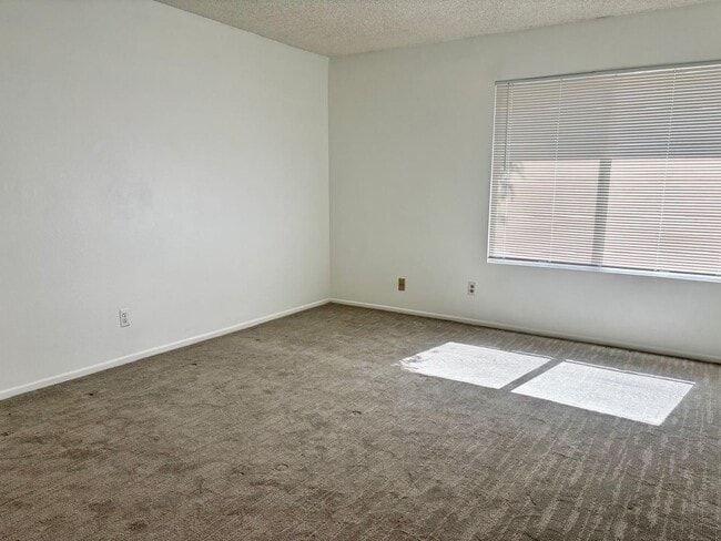 Building Photo - Available Now is a Condo style Townhouse i...