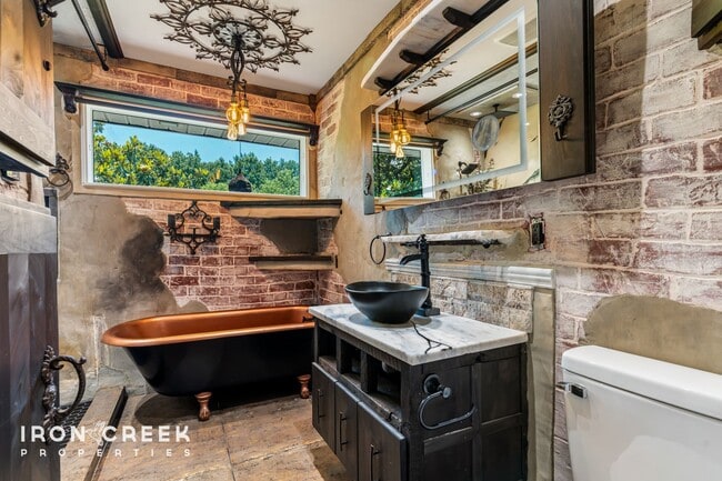 Building Photo - Beautifully Updated Three-Bedroom with Koi...