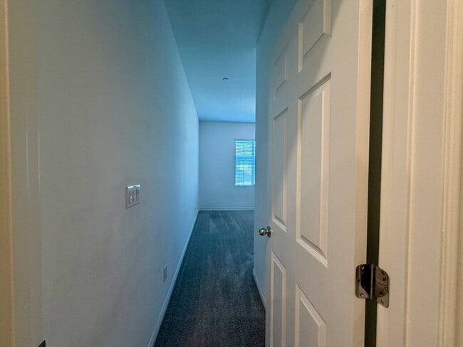 Building Photo - GATED 3 BED 2.5 BATH TOWNHOME WITH 2-CAR GARAGE, COVERED PATIO & COMMUNITY POOL